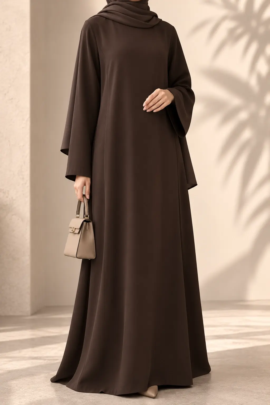 A full-length, Closed Abaya with a relaxed silhouette and wide sleeves.